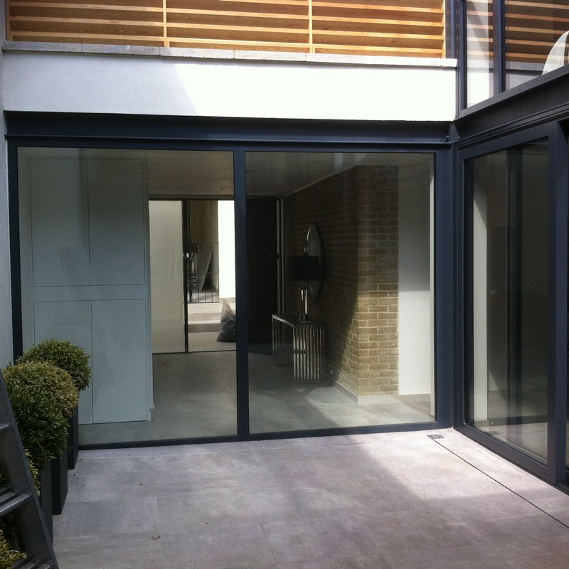 Floor-to-ceiling sliding doors opening to courtyard in Notting Hill